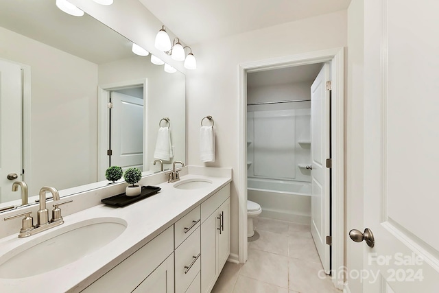 full bathroom with washtub / shower combination, tile patterned flooring, vanity, and toilet