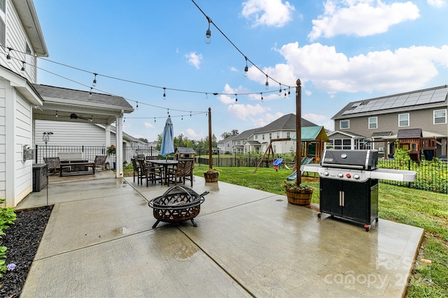 view of patio with a grill and a fire pit