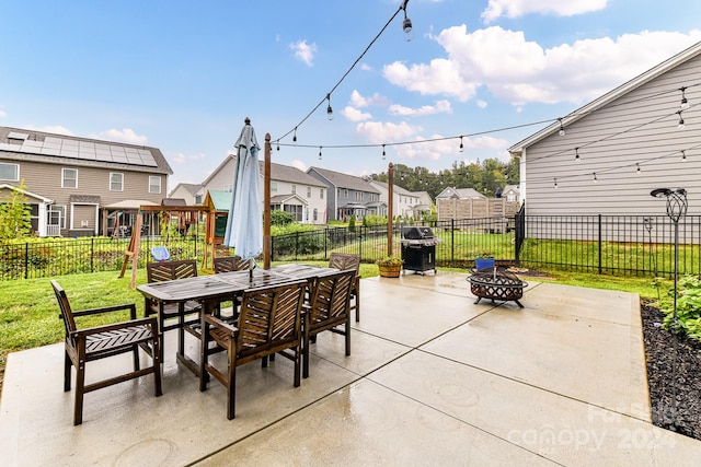 view of patio featuring a fire pit and grilling area