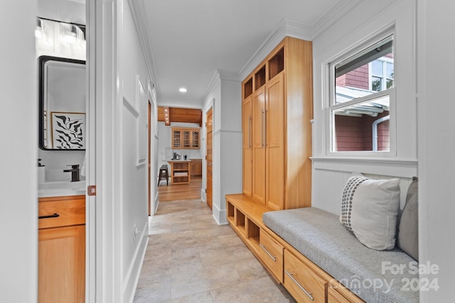 mudroom with ornamental molding