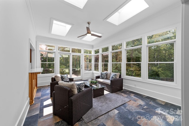 sunroom with lofted ceiling with skylight and ceiling fan