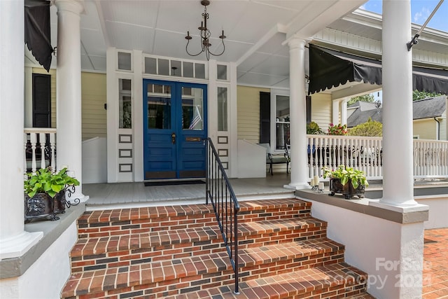 view of exterior entry featuring a porch