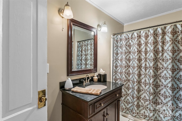 bathroom featuring a textured ceiling, crown molding, vanity, and walk in shower