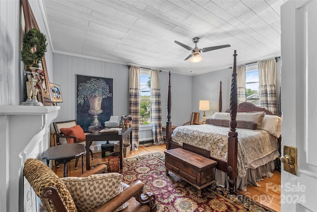 404 Avery Ave, Morganton, NC 28655 - bedroom with multiple windows, wood finished floors, a ceiling fan, and crown molding