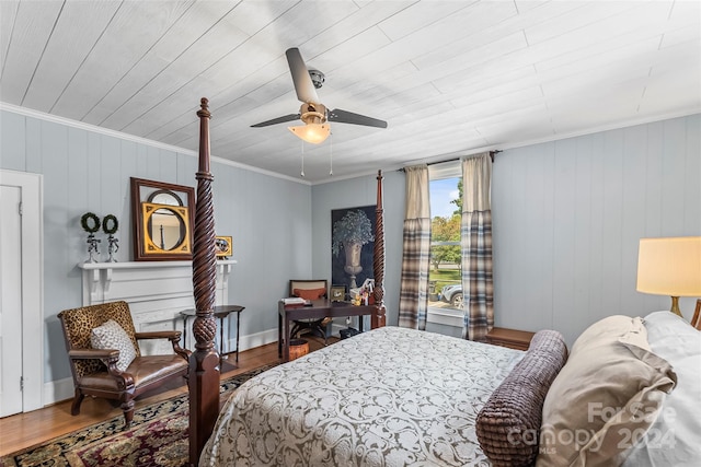 bedroom featuring ceiling fan, hardwood / wood-style flooring, and crown molding