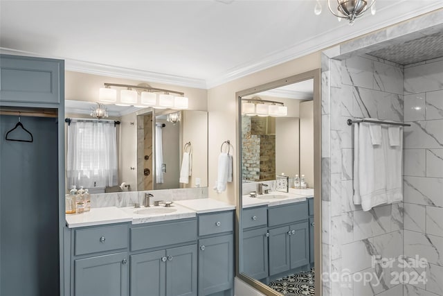 bathroom with vanity, crown molding, and tiled shower