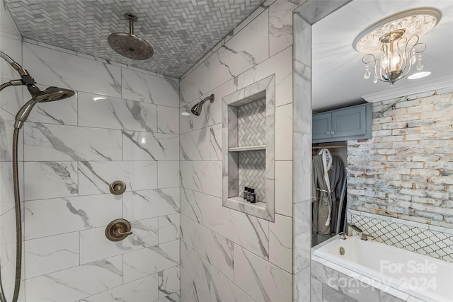 bathroom with tiled shower / bath combo and crown molding