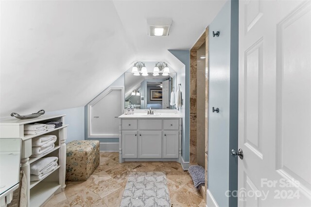 404 Avery Ave, Morganton, NC 28655 - bathroom with vanity, lofted ceiling, and a shower stall