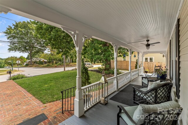 404 Avery Ave, Morganton, NC 28655 - porch featuring a ceiling fan and a yard