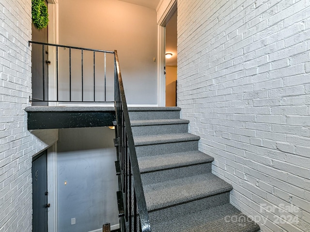 stairs with brick wall