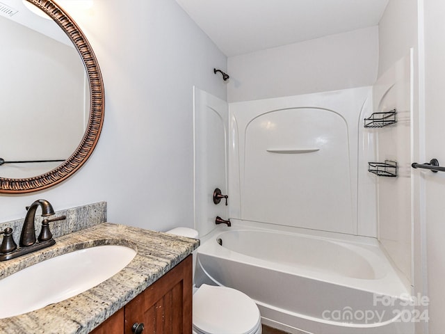 full bathroom with shower / tub combination, vanity, and toilet