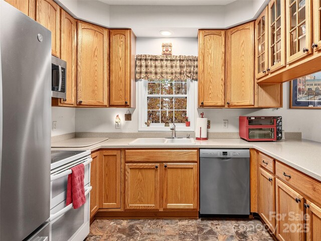 kitchen featuring stainless steel appliances and sink