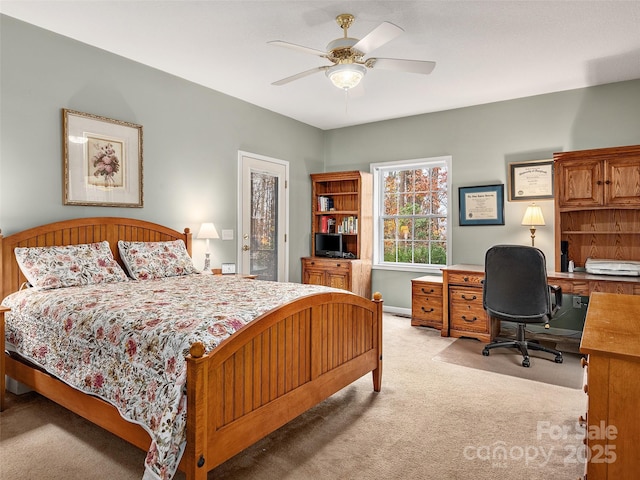 bedroom featuring ceiling fan and light carpet