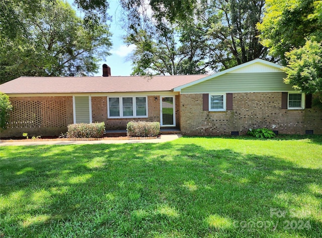 ranch-style home with a front yard