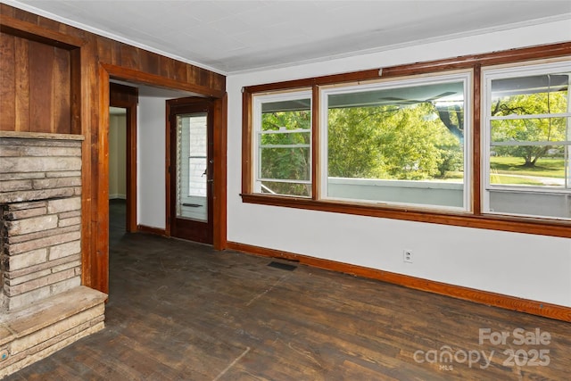 interior space with crown molding and dark hardwood / wood-style floors