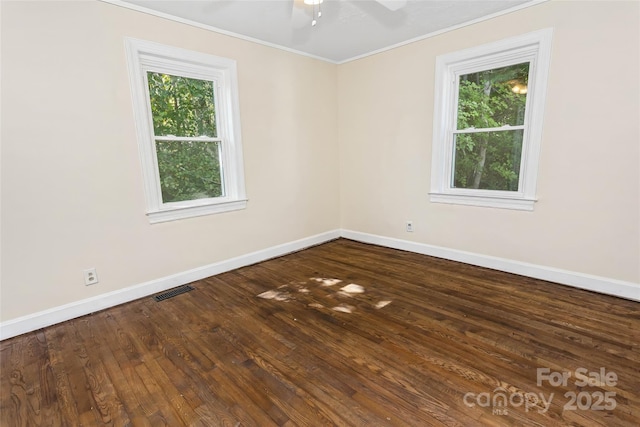 unfurnished room with ceiling fan, crown molding, and wood-type flooring