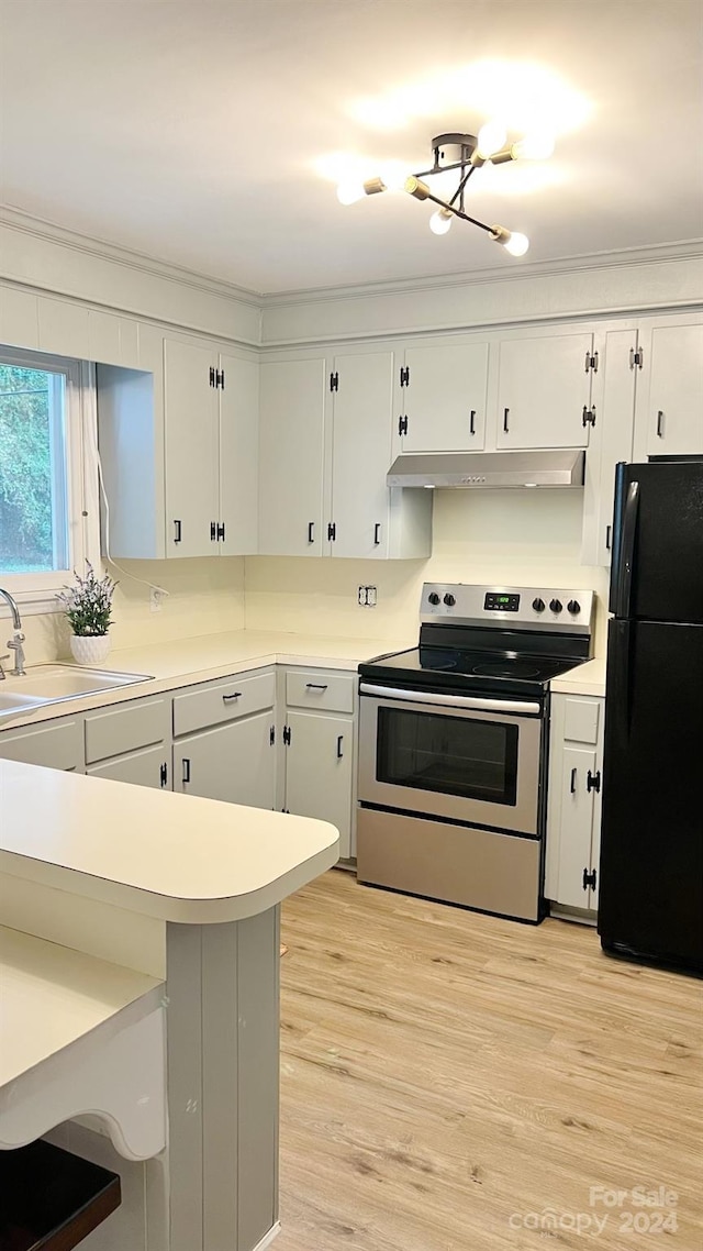 kitchen with white cabinetry, stainless steel electric range, black refrigerator, light wood-type flooring, and sink