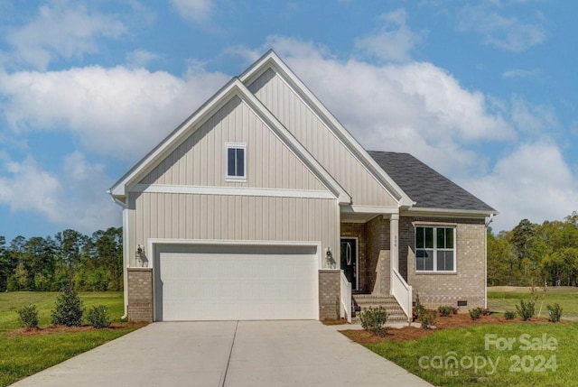 craftsman-style home with a garage and a front yard