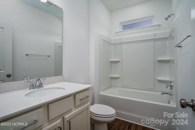 full bathroom featuring wood-type flooring, vanity, toilet, and shower / bathtub combination