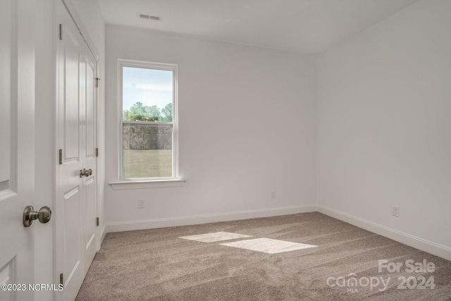 unfurnished room with carpet flooring