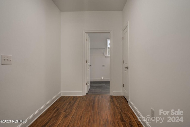 hallway featuring dark hardwood / wood-style flooring