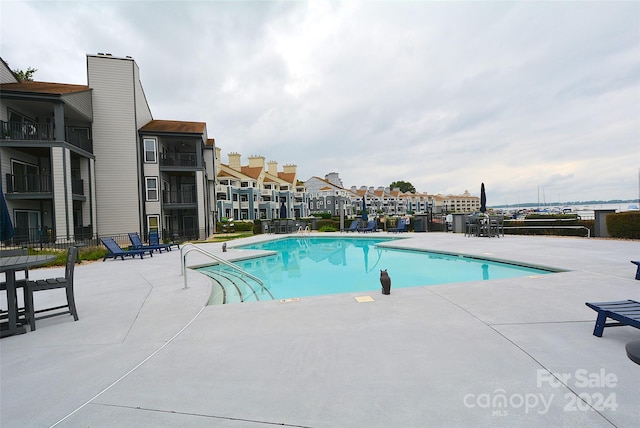 view of swimming pool with a patio area