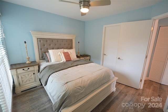 bedroom with ceiling fan and dark hardwood / wood-style floors