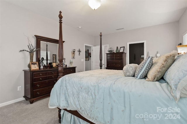 bedroom featuring light carpet