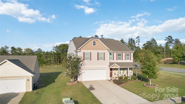 view of front facade with a garage and a front lawn