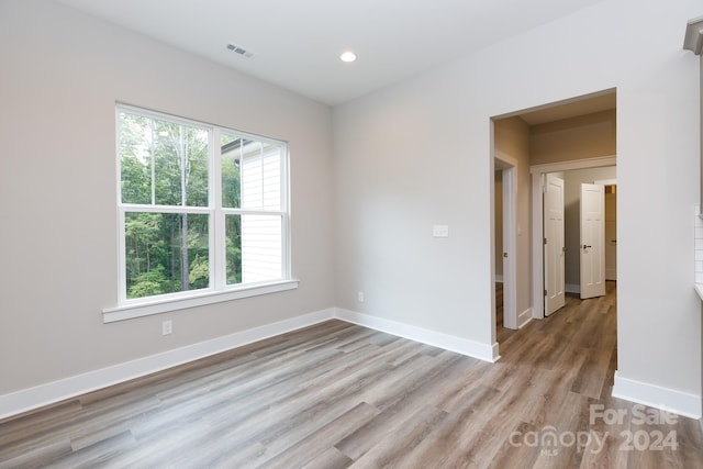 spare room with light hardwood / wood-style floors