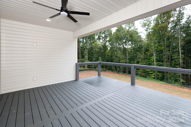 wooden deck featuring ceiling fan