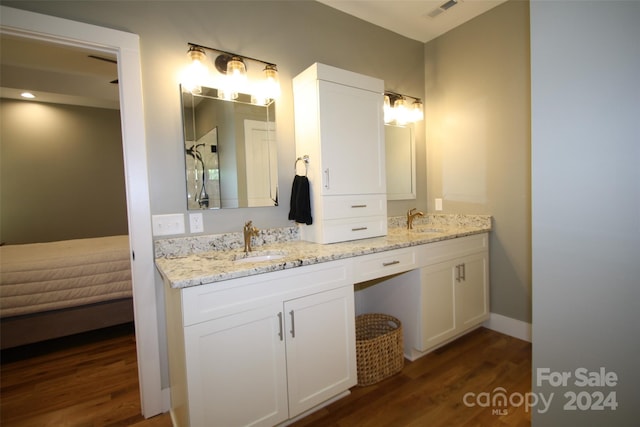 bathroom featuring hardwood / wood-style floors and vanity