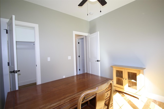 unfurnished office featuring ceiling fan