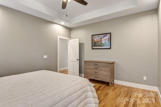 bedroom featuring recessed lighting, ceiling fan, light wood-style flooring, and baseboards