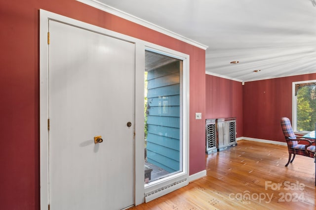 hallway featuring light hardwood / wood-style flooring and ornamental molding