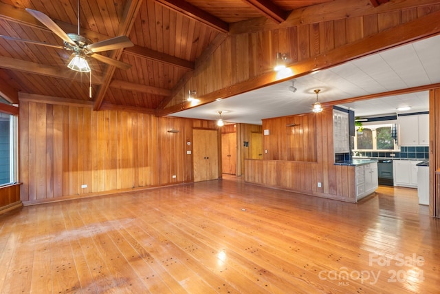 unfurnished living room featuring vaulted ceiling with beams, ceiling fan, wood ceiling, and light hardwood / wood-style flooring