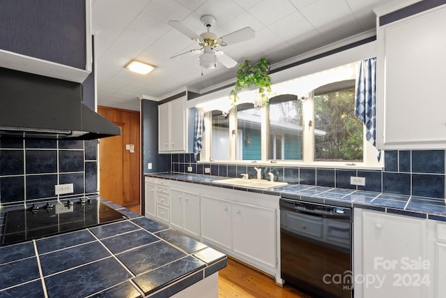 kitchen with decorative backsplash, ceiling fan, sink, black appliances, and white cabinets