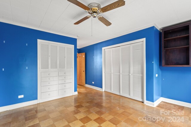 unfurnished bedroom featuring ceiling fan and crown molding