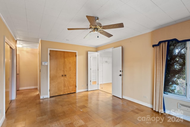 unfurnished bedroom featuring ceiling fan and ornamental molding