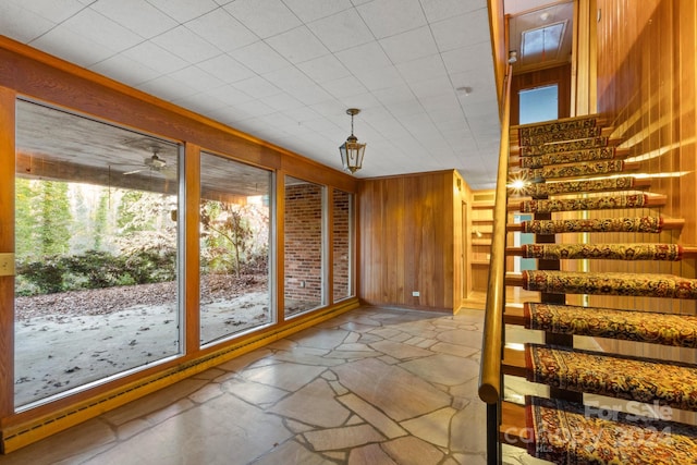 doorway featuring wood walls