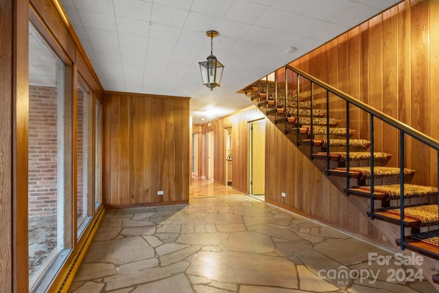 stairs with wood walls