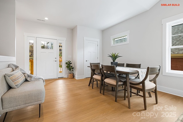 dining area with recessed lighting, visible vents, light wood-style flooring, and baseboards