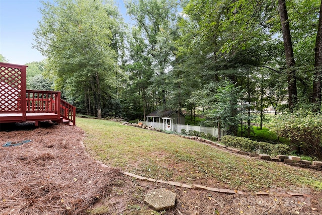 view of yard with a wooden deck