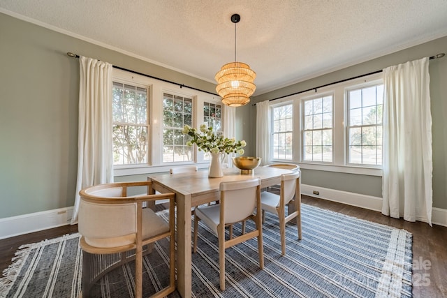 dining room with dark hardwood / wood-style floors and a textured ceiling