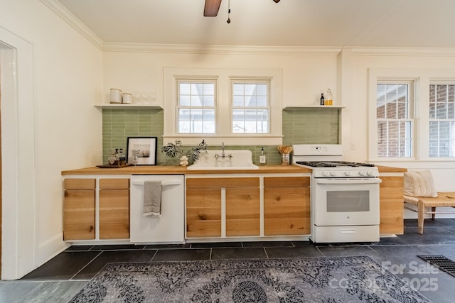 kitchen featuring ceiling fan, sink, backsplash, white appliances, and ornamental molding