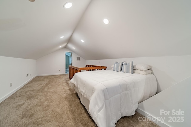 bedroom featuring carpet floors and lofted ceiling