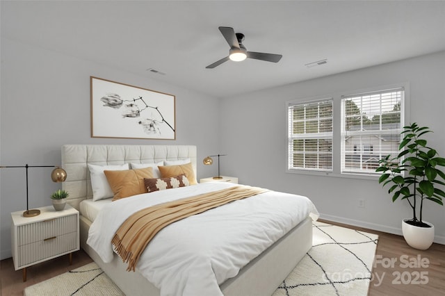 bedroom featuring hardwood / wood-style floors and ceiling fan