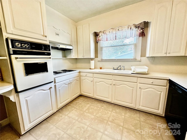 kitchen with white appliances, a textured ceiling, extractor fan, and sink