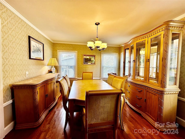 dining space featuring ornamental molding, a chandelier, and dark wood-type flooring