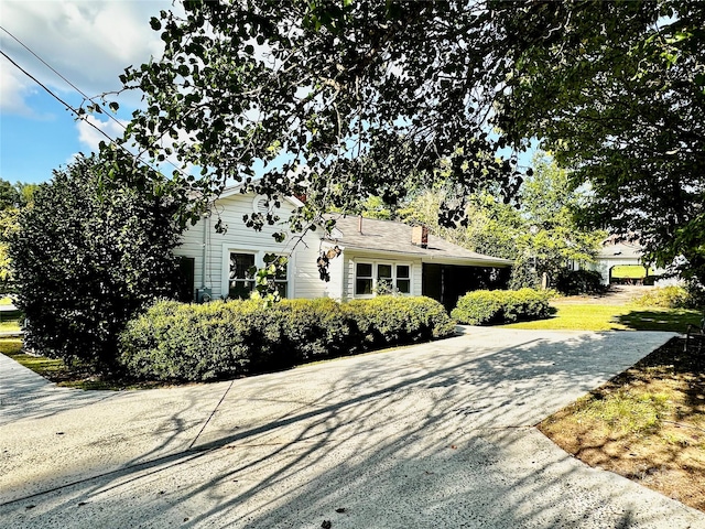 view of side of home featuring a yard